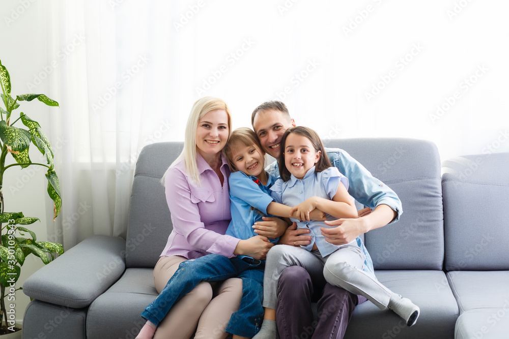 Portrait of a happy family smiling at home