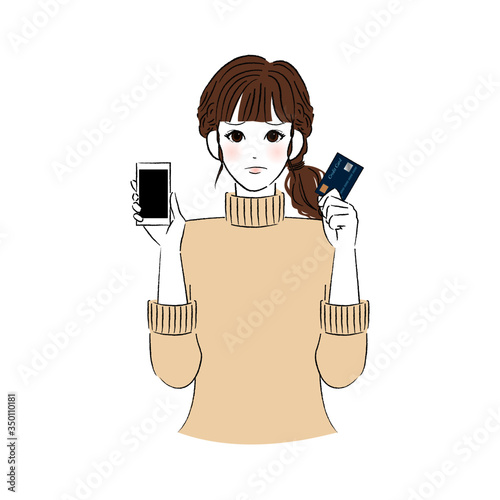 困り顔のスマホとキャッシュカードを持つ女性