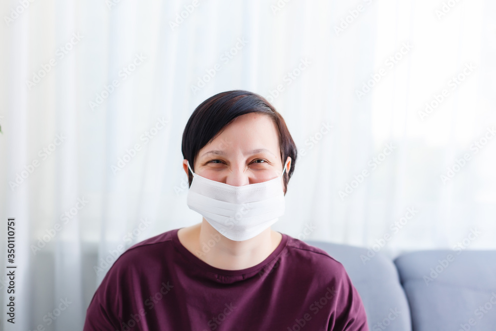 Girl with mask to protect her from Corona virus. Corona virus pandemic. woman wearing a face mask, looking at camera