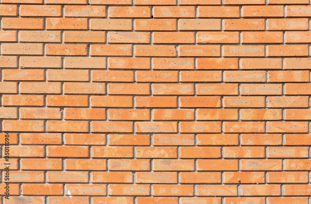 solid wall of new brown brick, frontal arrangement solid wall of new brown brick, frontal arrangement