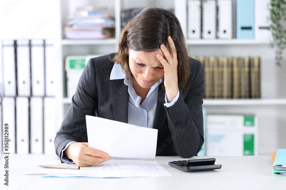 Sad executive lady complaining about bad results at office Sad executive lady complaining about bad results at office
