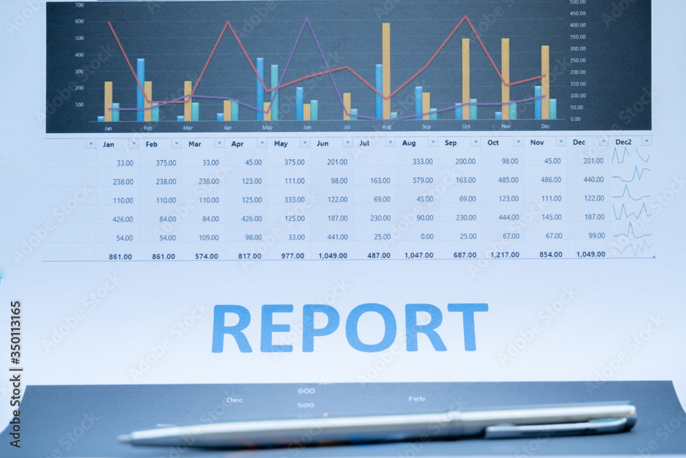 pen on report document about the charts, graphs and showing the results for planning management new project pen on report document about the charts, graphs and showing the results for planning management new project