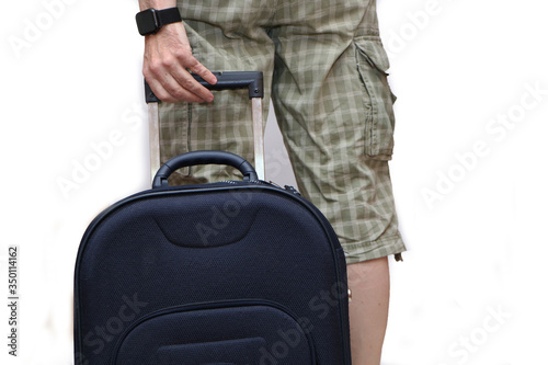 A man pulls a suitcase from the back.