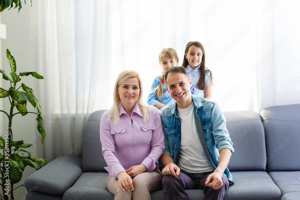Portrait of a happy family smiling at home Portrait of a happy family smiling at home