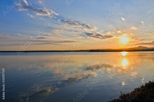 Sunset at Salt Lake  Larnaca  Cyprus. Reflection of the sky and clouds in the lake.