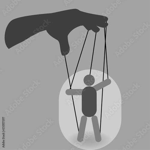Hand with a puppet on ropes, manipulation concept