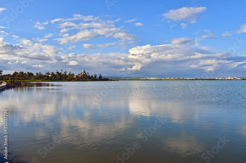 Fototapeta Naklejka Na Ścianę i Meble -  A view of Hala Sultan Tekke in Larnaca, Cyprus, with reflection in the Salt Lake.