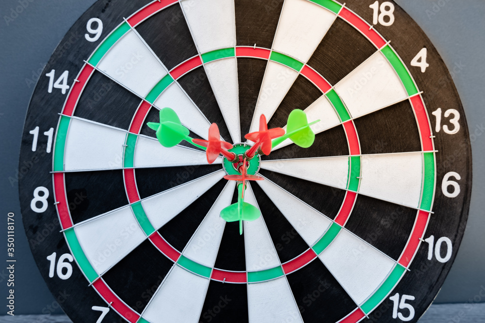The arrow in the middle of the dartboard Demonstrate the concept of a successful business goal The arrow in the middle of the dartboard Demonstrate the concept of a successful business goal