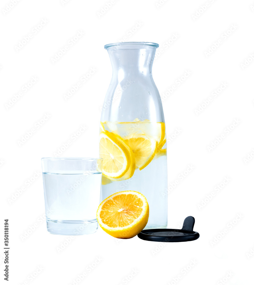 transparent carafe with water
and lemon. A glass of water. Isolate transparent carafe with water
and lemon. A glass of water. Isolate