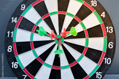 The arrow in the middle of the dartboard Demonstrate the concept of a successful business goal
