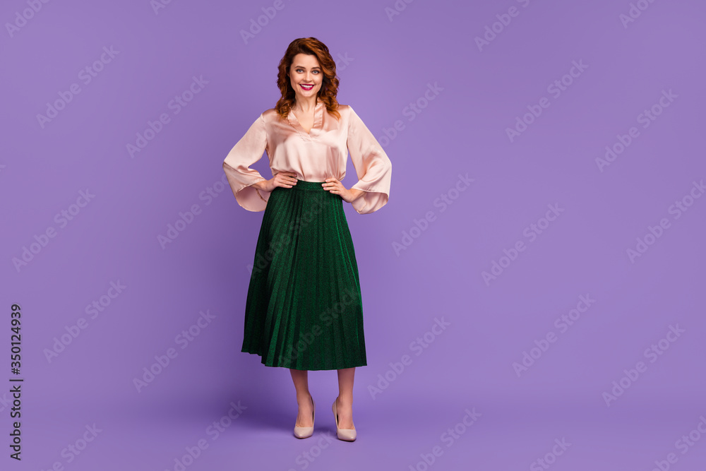 Full body photo of attractive nice girl put hands waist look in camera wear stylish clothes isolated over violet color background Full body photo of attractive nice girl put hands waist look in camera wear stylish clothes isolated over violet color background
