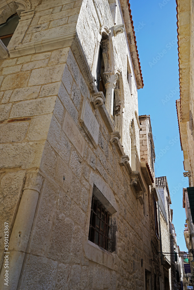 Exterior architecture and design of Trogir historic town and harbour on the Adriatic coast in Split-Dalmatia, Croatia