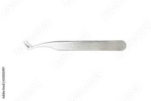 Metal tweezers isolated on a white background. Body care concept. Creative background, copy space.