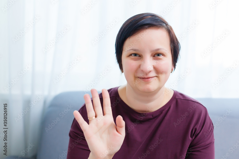 Headshot portrait of smiling young woman. girl with happy facial expression looking at camera with joy, communicating with friends via internet telephony, making video call. Close up. Front view Headshot portrait of smiling young woman. girl with happy facial expression looking at camera with joy, communicating with friends via internet telephony, making video call. Close up. Front view