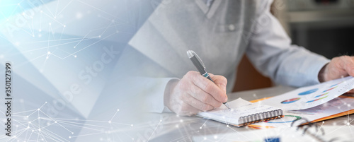 Businessman working on financial results; panoramic banner