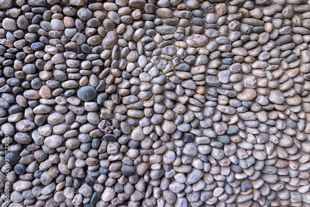 Texture detail of a wall with a surface composed of stones Texture detail of a wall with a surface composed of stones