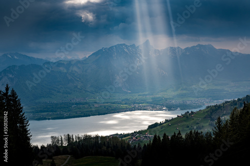 dramatic light on Lake Thun and over Thun seen from over Sigriswil © schame87
