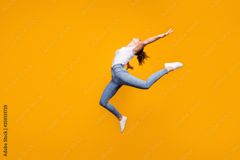 Full length body size view of her she nice attractive lovely graceful flexible healthy strong girl jumping dancing contemporary isolated on bright vivid shine vibrant yellow color background
