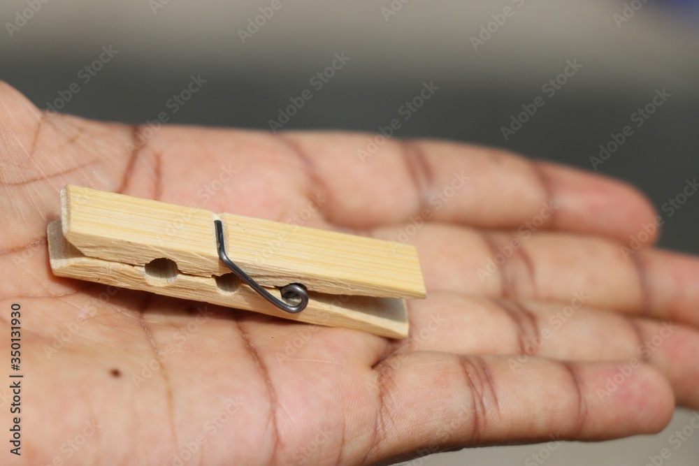 Cloth hanging clip made of wood held in hand Cloth hanging clip made of wood held in hand