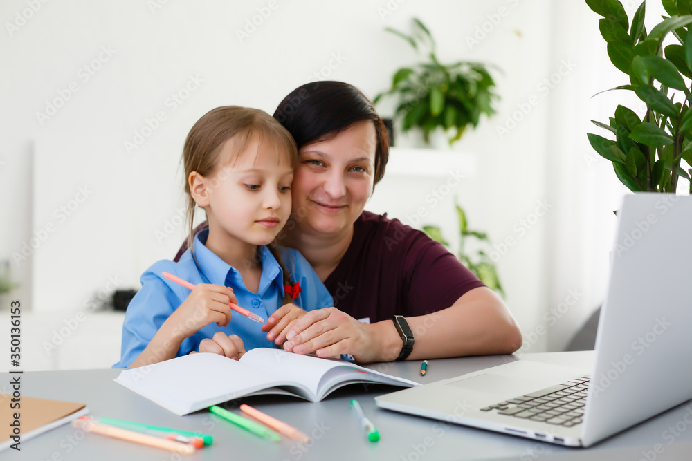 picture of mother and daughter with a laptop pc picture of mother and daughter with a laptop pc