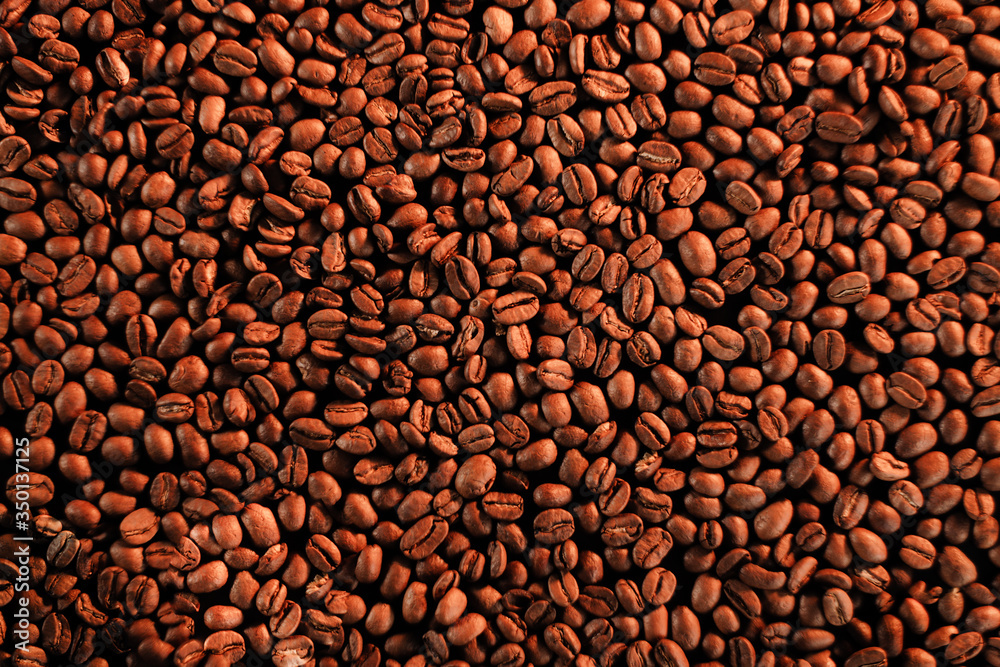 roasted coffee beans, can be used as background. Grains after roasting on golden roasted coffee beans, can be used as background. Grains after roasting on golden