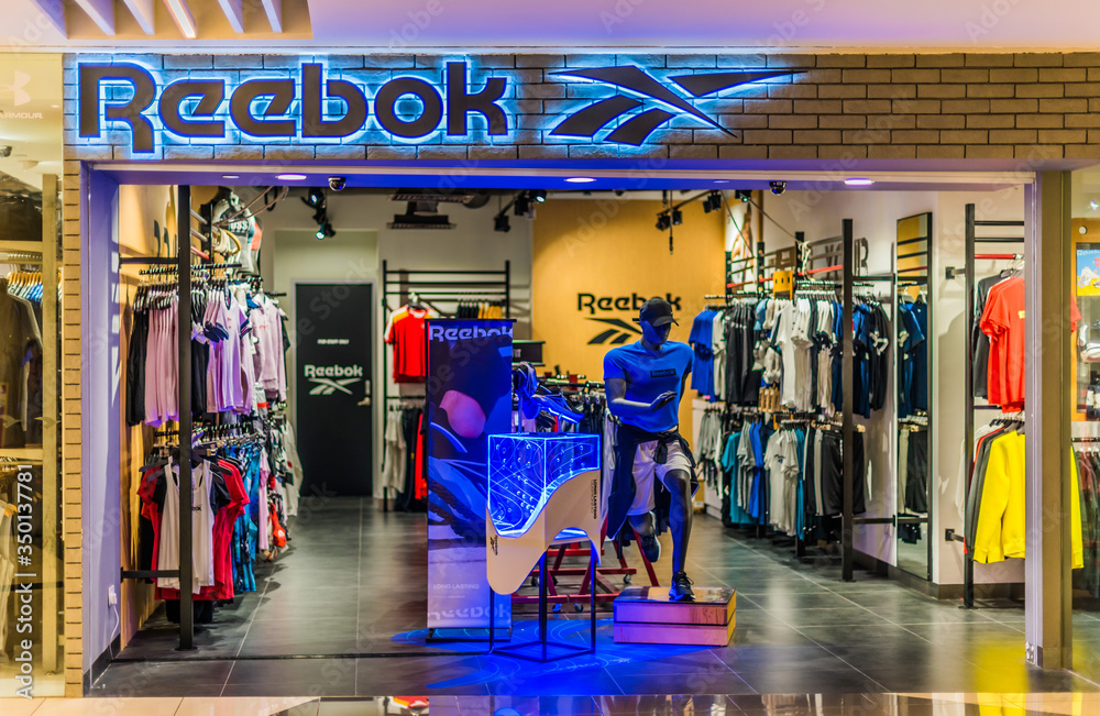 Front entrance to Reebok store in Singapore shopping mall Stock Photo |  Adobe Stock