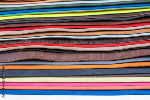 Selection of coloured or tanned leather on display at Camden market in London
