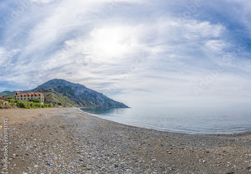 Panoramic View of Cape Ai-Fock, Veselovskaya bay and the beach of the village of Vesyoloe in the Crimea. On the foreground is the western foot of Mount Karaul-Oba. Azure Black Sea near Sudak photo