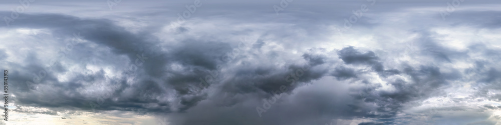 blue sky with beautiful dark clouds before storm. Seamless hdri panorama 360 degrees angle view with zenith for use in 3d graphics or game development as sky dome or edit drone shot