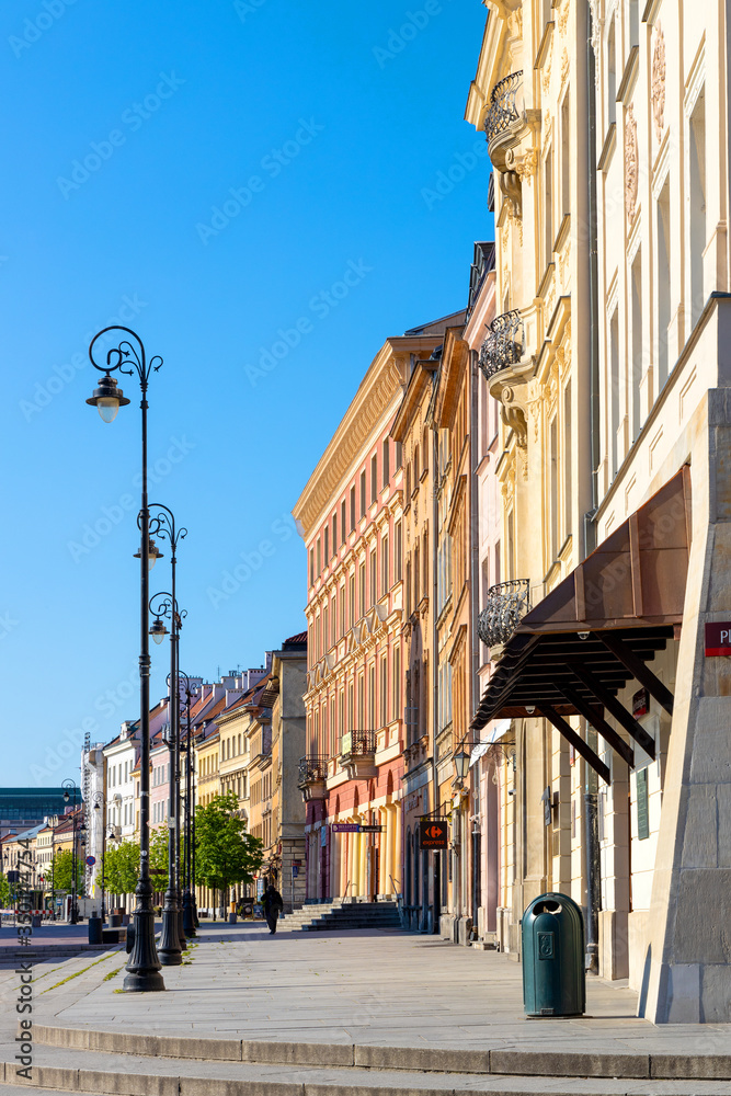 Fototapeta premium Panoramic view of Krakowskie Przedmiescie street with historic tenement houses in Starowka Old Town quarter of Warsaw, Poland