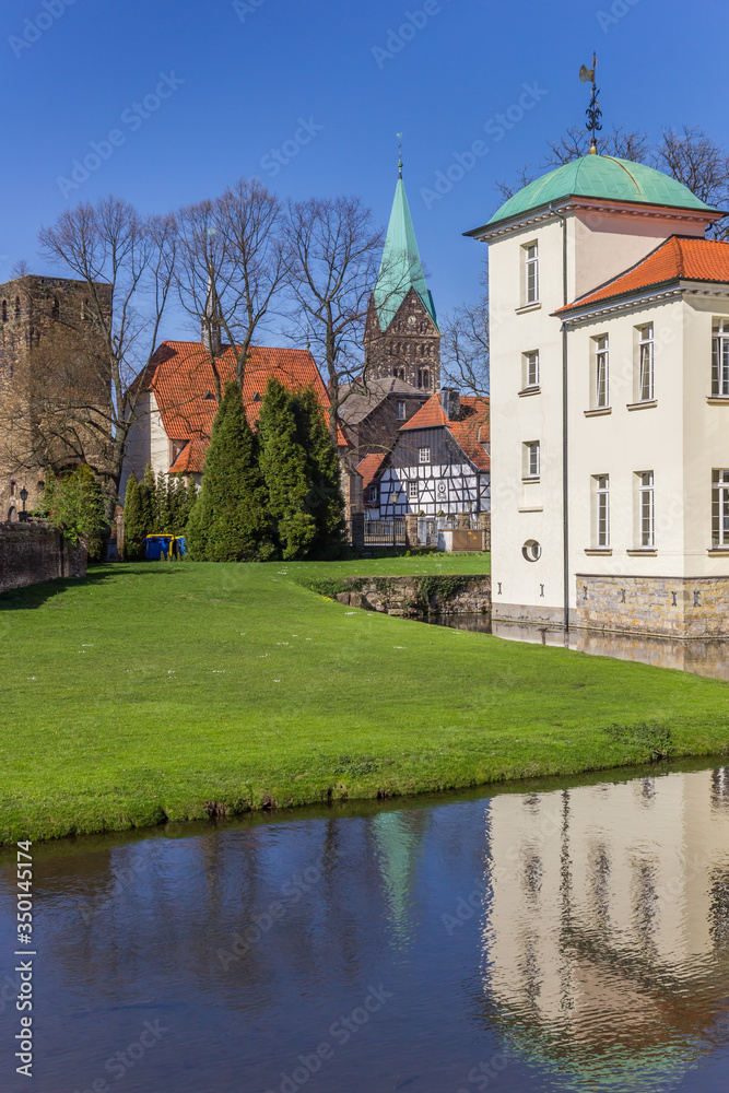 Towers of the castle and church in the Old Village of Westerholt, Germany