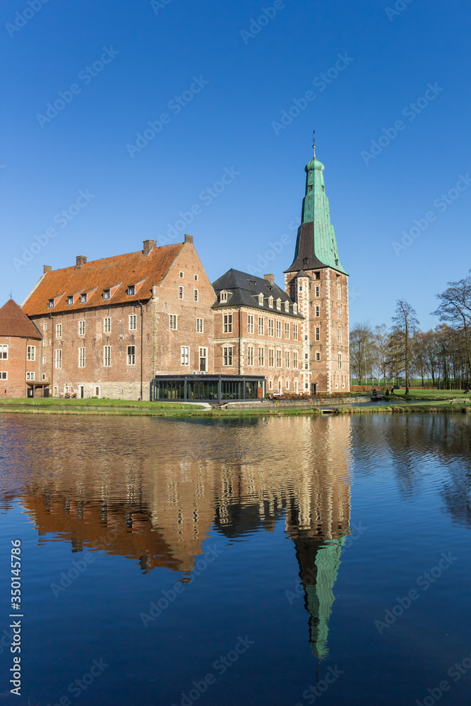 Castle Raesfeld with reflection in the water in Germany Castle Raesfeld with reflection in the water in Germany