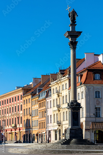 Panoramic view of Krakowskie Przedmiescie street with Sigismund III Waza Column monument and historic tenement houses in Starowka Old Town quarter of Warsaw, Poland photo