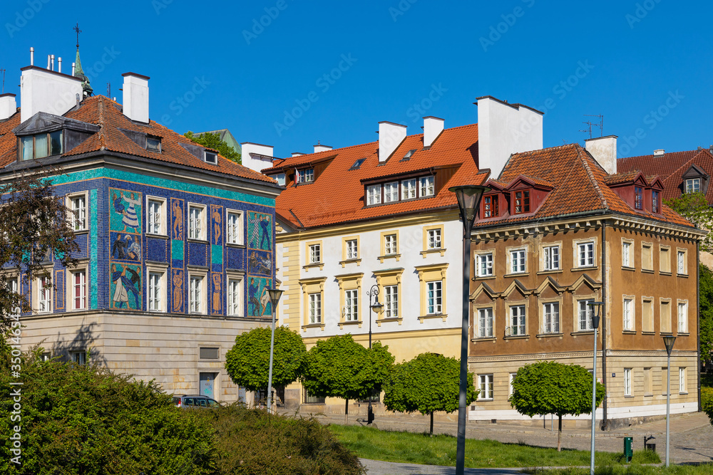Panoramic view of historic, richly decorated colorful tenement houses at Bugaj, Mostowa and Brzozowa streets of Starowka Old Town quarter in Warsaw, Poland