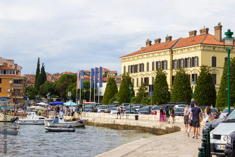 Rovinj, Croatia; 7/18/2019: Picture of the port of Rovinj, Croatia, with a lot of boats on the Mediterranean Sea and the town at the background