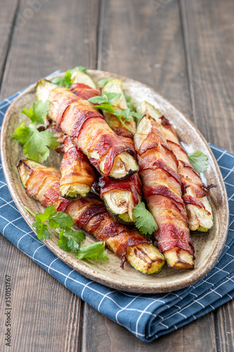 Grilled zucchini fries wrapped in a bacon