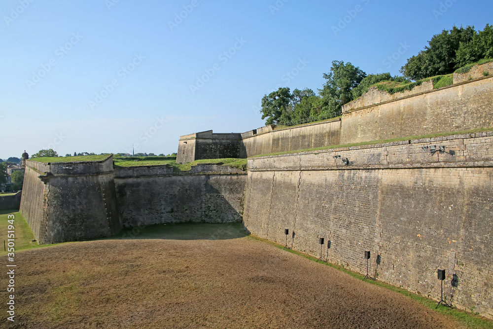 Historic city walls around the moat and fortifications to the citadel of Blaye, Gironde department in Nouvelle- Aquitaine in southwestern France.
