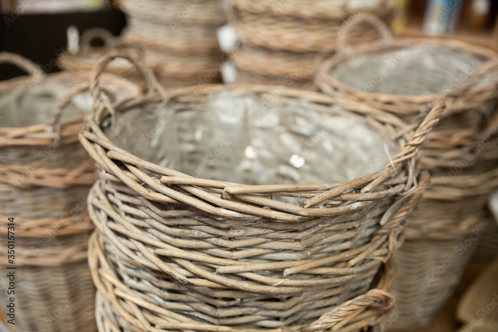 Wicker baskets on shelves in store