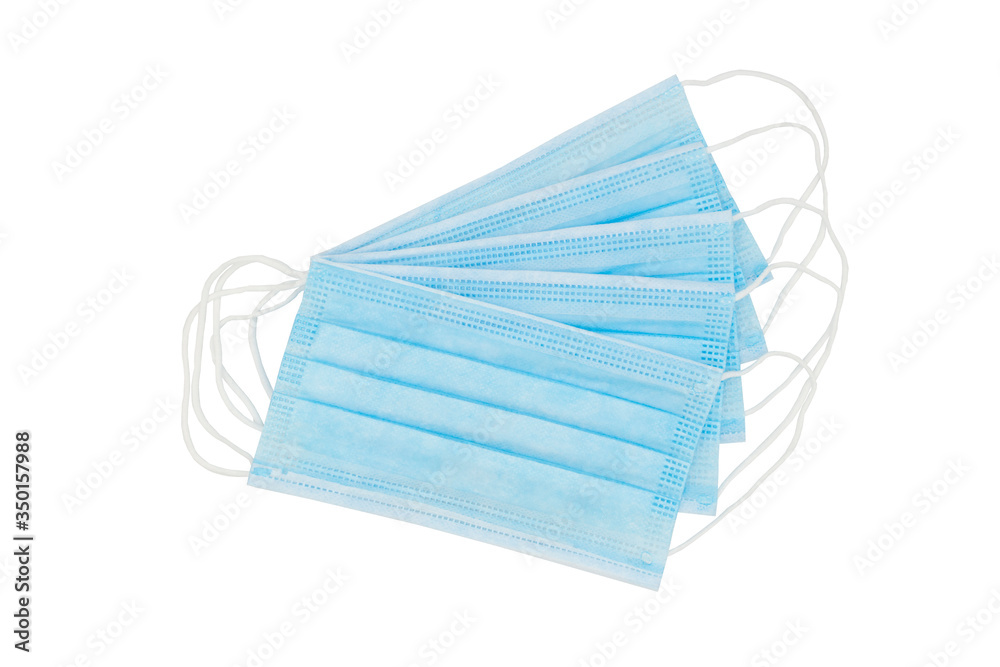 Isolated medical, surgical masks lie on top of each other to protect against flu, antiviral infections, and corona virus. Concept of safety, clean air and breathing. Isolated medical, surgical masks lie on top of each other to protect against flu, antiviral infections, and corona virus. Concept of safety, clean air and breathing.