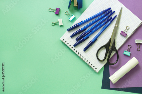 Various office stationery on a mint background