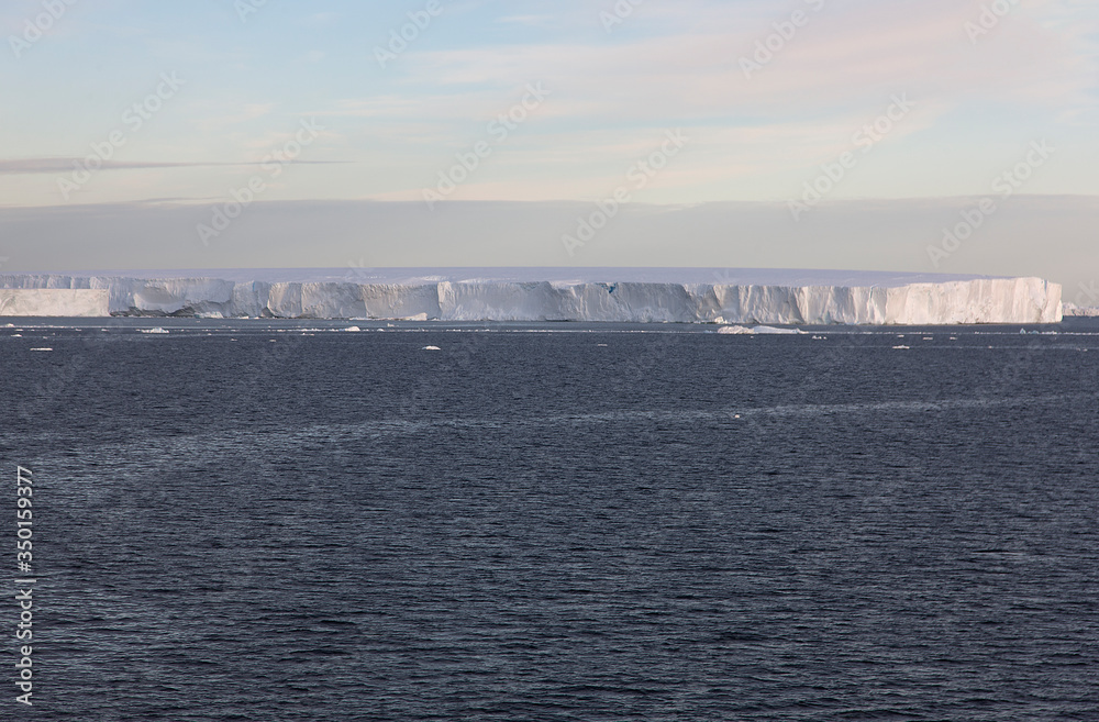 Antarctica landscape with icebergs and on a cloudy winter day