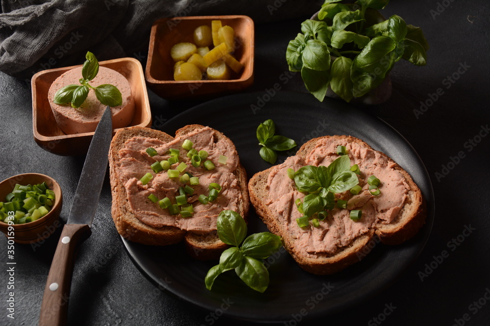 Chicken or goose liver pate sandwiches on a plate Chicken or goose liver pate sandwiches on a plate