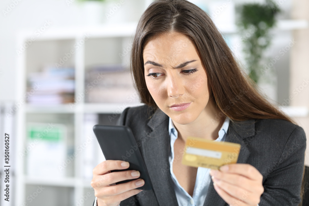 Suspicious executive pays with card on phone at office Suspicious executive pays with card on phone at office