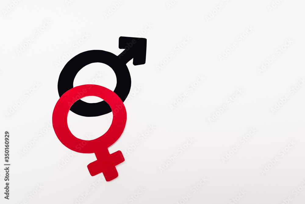 top view of red and black gender symbols isolated on white top view of red and black gender symbols isolated on white