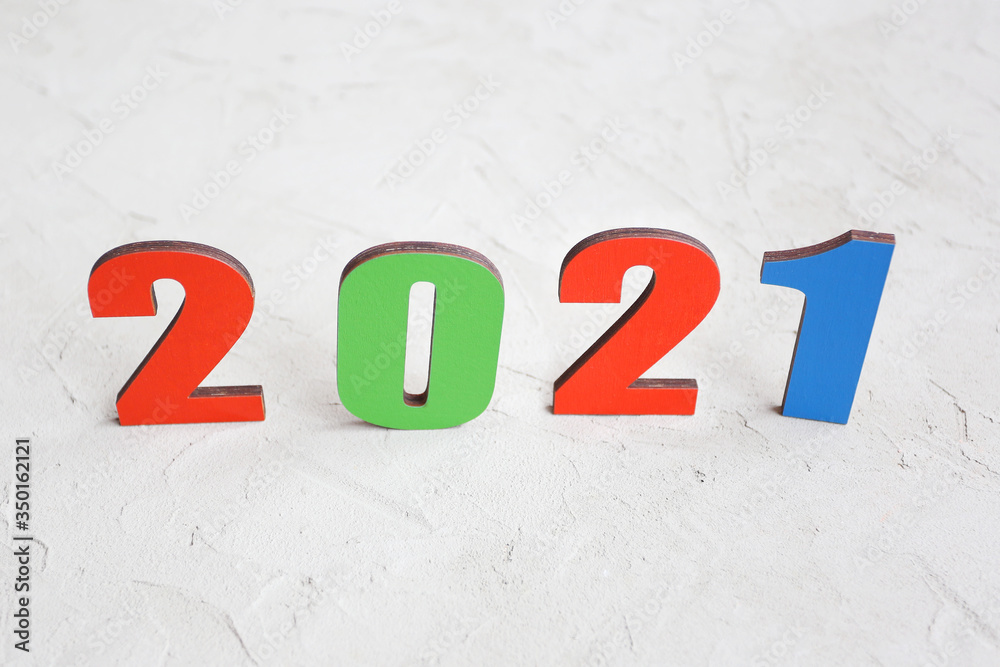 Happy new year 2021. Christmas or New year holiday background with the number 2021. Banner with wooden numbers 2021