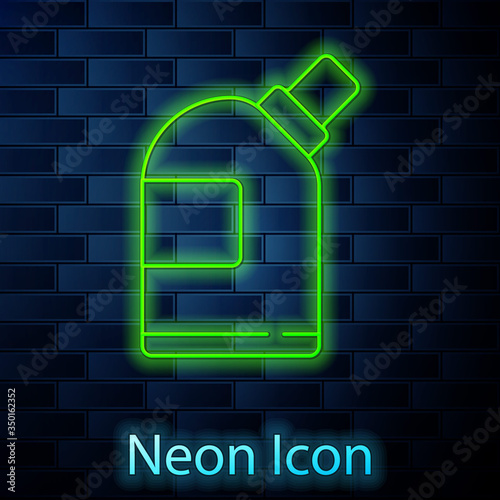 Glowing neon line Plastic bottles for laundry detergent, bleach, dishwashing liquid or another cleaning agent icon isolated on brick wall background. Vector Illustration