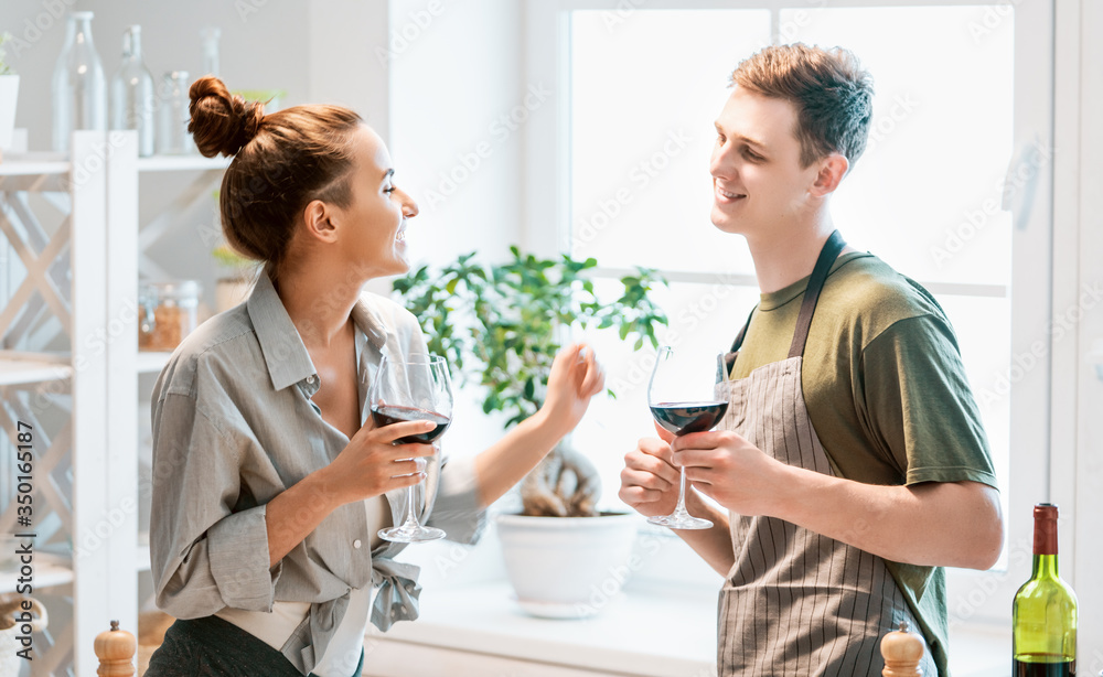 loving couple is preparing the proper meal loving couple is preparing the proper meal