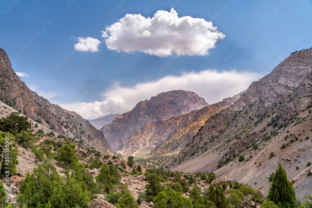 The beautiful view of blue sky and snow mountain summit near to Kaltsit peak in Fann mountains in Tajikistan