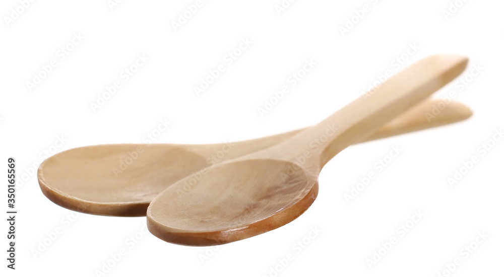 Pair of empty wooden spoons isolated on white background with clipping path Pair of empty wooden spoons isolated on white background with clipping path