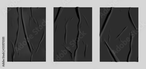 Black glued paper set with wet wrinkled effect on gray background. Black wet paper poster template set with crumpled texture. Realistic vector posters mockup